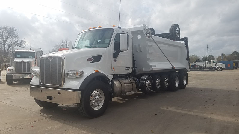 Peterbilt 567 Super Dump - Driver Front Angle Axles Up