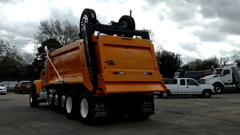 International HX520 Super Dump - Driver Rear Angle Axles Up