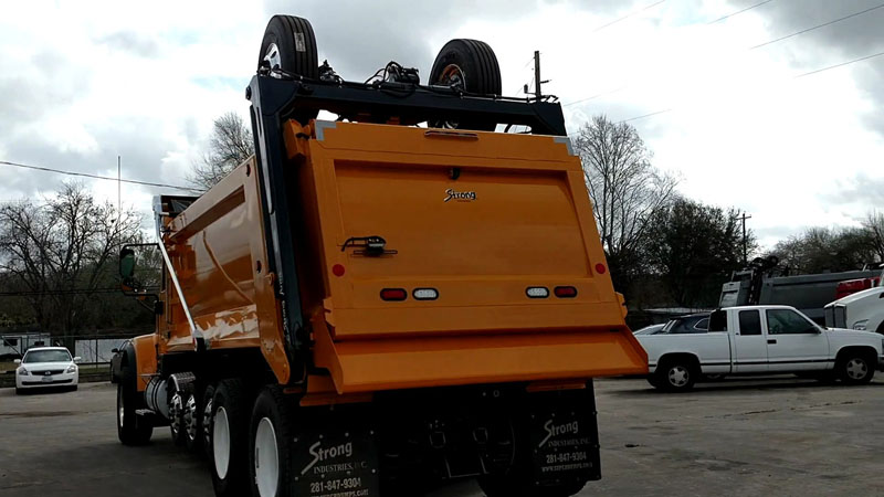 International HX520 Super Dump - Driver Rear Angle