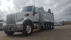 Peterbilt 567 Super Dump - Driver Front Angle Axles Up Peterbilt 567 Super Dump - Driver Front Angle Axles Up