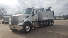 Peterbilt 567 Super Dump - Driver Front Angle Axles Up