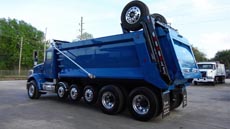 Peterbilt Super Dump Blue - Driver Rear Angle Peterbilt Super Dump Blue - Driver Rear Angle