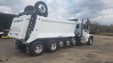 Peterbilt 567 Super Dump - Passenger Rear Angle Axles Up Peterbilt 567 Super Dump - Passenger Rear Angle Axles Up