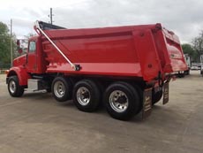 Peterbilt Tri-Axle Dump Truck Mule - Driver Rear Angle Peterbilt Tri-Axle Dump Truck Mule - Driver Rear Angle