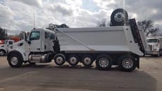 Peterbilt 567 Super Dump - Driver Side Angle Axles Up Peterbilt 567 Super Dump - Driver Side Angle Axles Up
