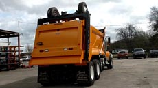 International HX520 Super Dump - Passenger Rear Angle International HX520 Super Dump - Passenger Rear Angle